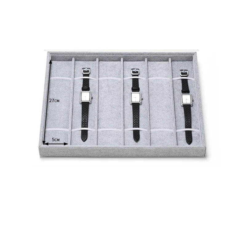 Plateau montres 6 emplacements – plateau cuir noir avec trois montres : compartiments 27 x 5 cm