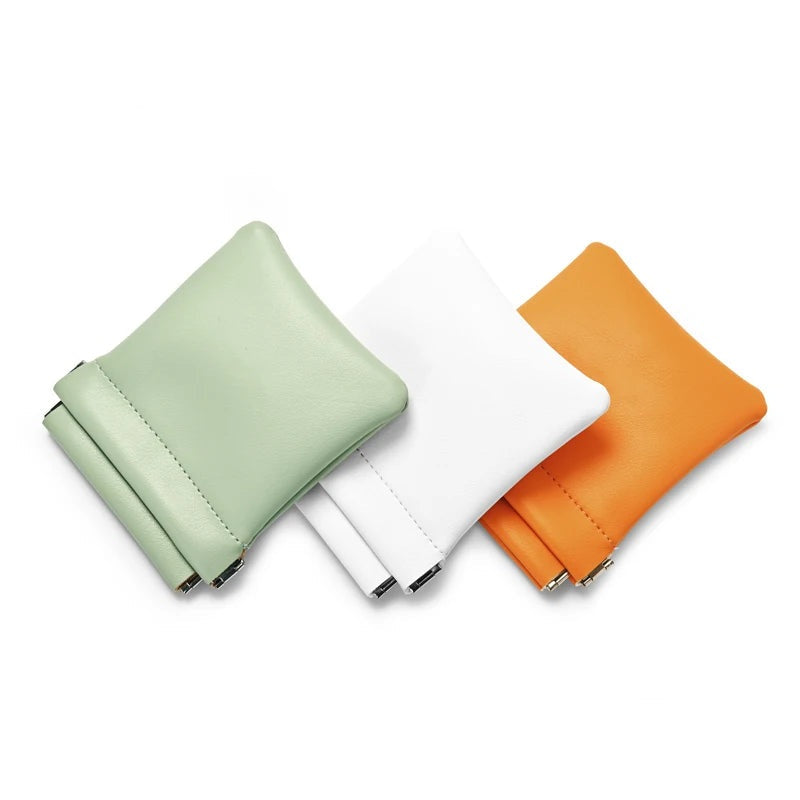 Mini pochette bijoux à ressort – coloris vert menthe, blanc et orange vus de dessus